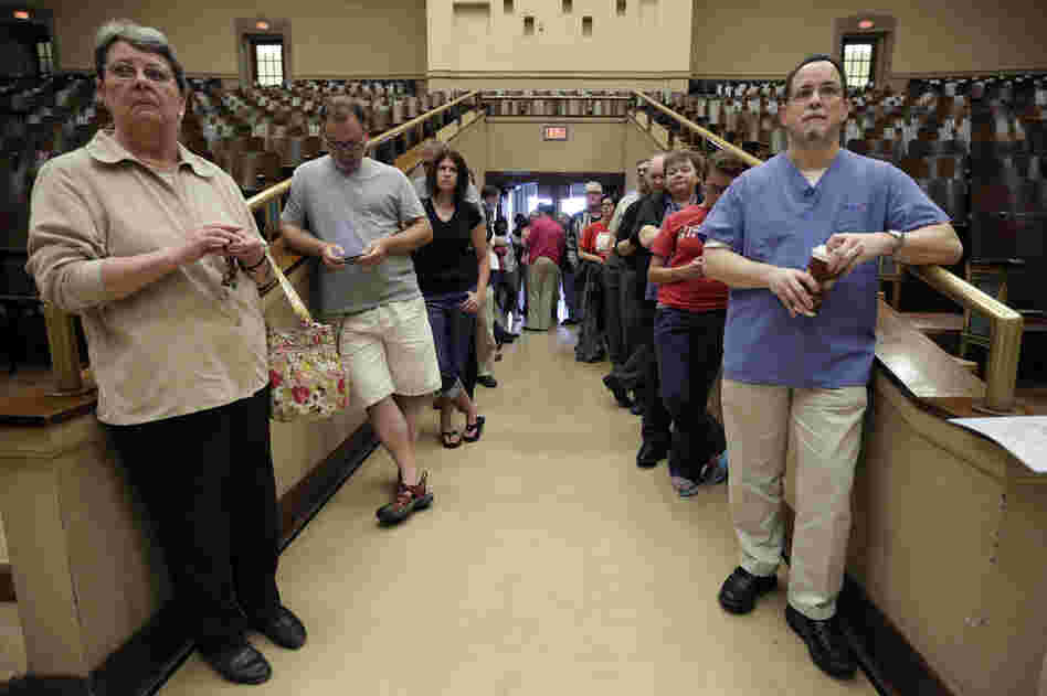 Voters line up at the French Immersion School in Milwaukee to decide between Walker and Barrett.