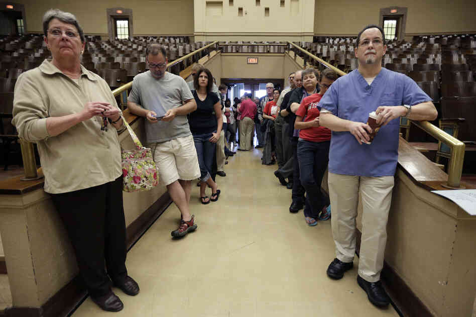 Voters line up at the French Immersion School in Milwaukee to decide between Walker and Barrett.