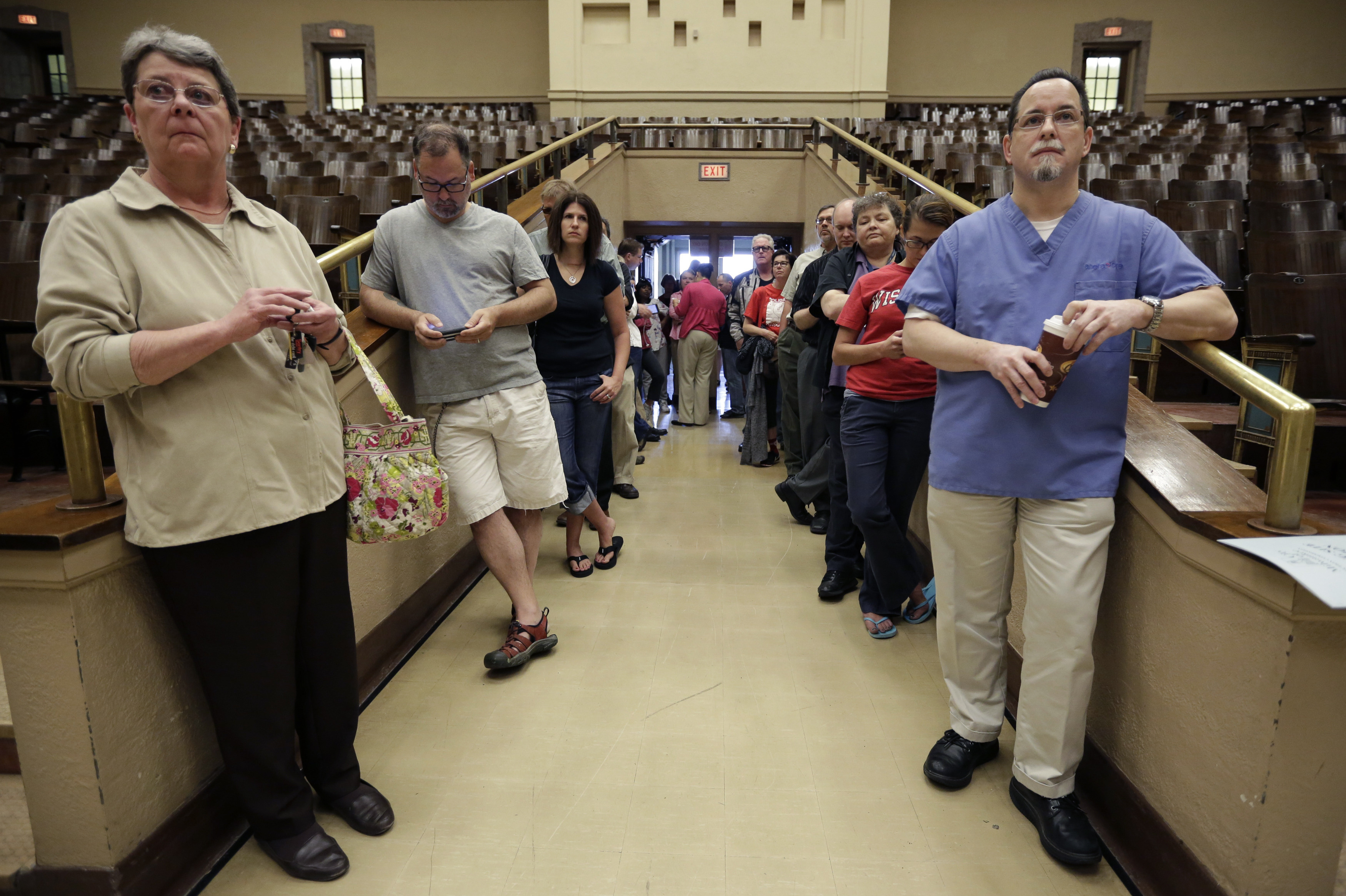 Voters line up at the French Immersion School in Milwaukee to decide between Walker and Barrett.
