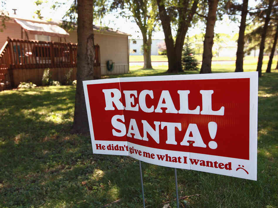 A sign supporting Wisconsin Gov. Scott Walker outside a home in Clinton, Wis.