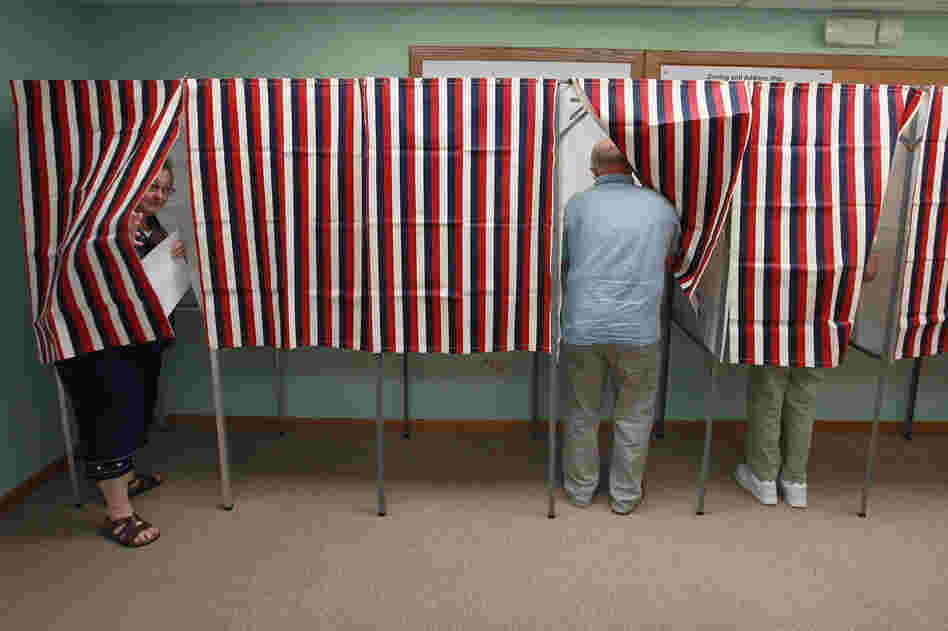 Voters in Clinton, cast ballots Tuesday in the state's recall election. The election was forced by opponents of Walker's controversial effort to curb collective bargaining for public employees in the state.