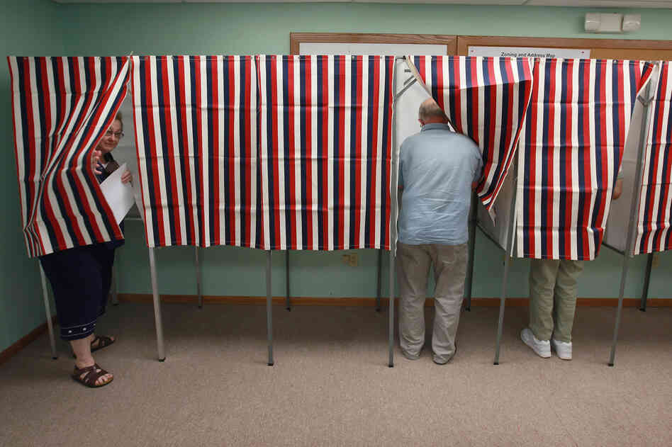 Voters in Clinton, cast ballots Tuesday in the state's recall election. The election was forced by opponents of Walker's controversial effort to curb collective bargaining for public employees in the state.