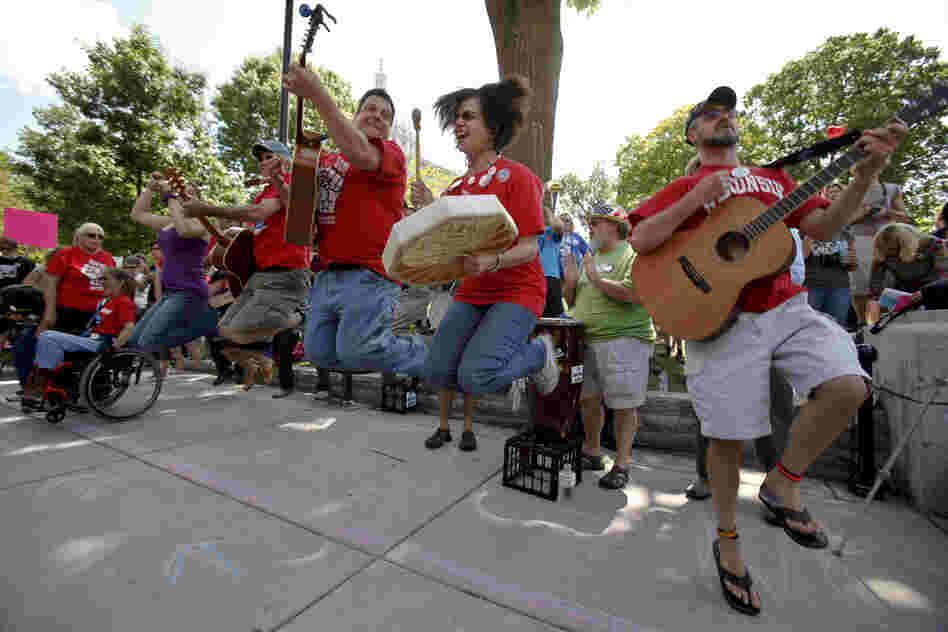 The Solidarity Singers play union songs in support of recalling Walker near the Capitol in Madison.