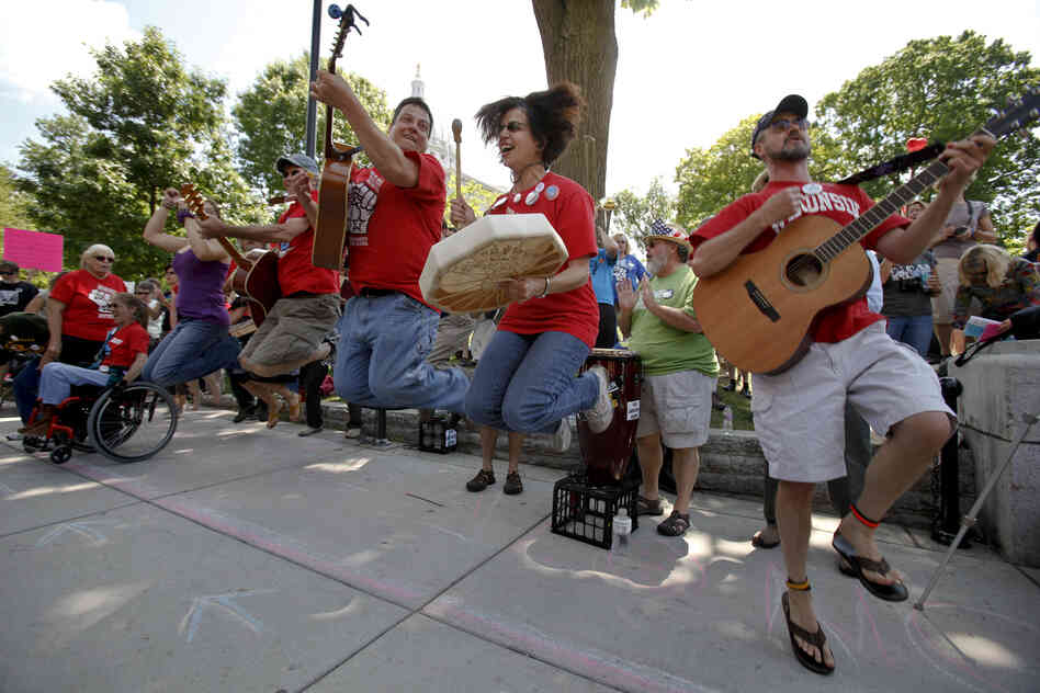 The Solidarity Singers play union songs in support of recalling Walker near the Capitol in Madison.