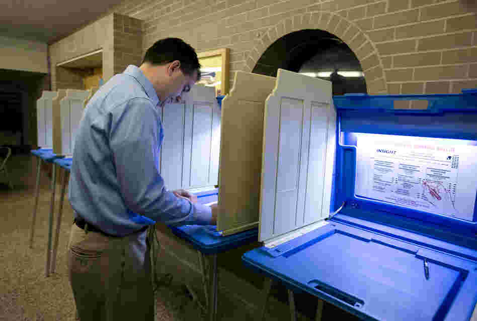 Walker votes in Wauwatosa. He is trying to become the first U.S. governor to successfully fend off a recall.