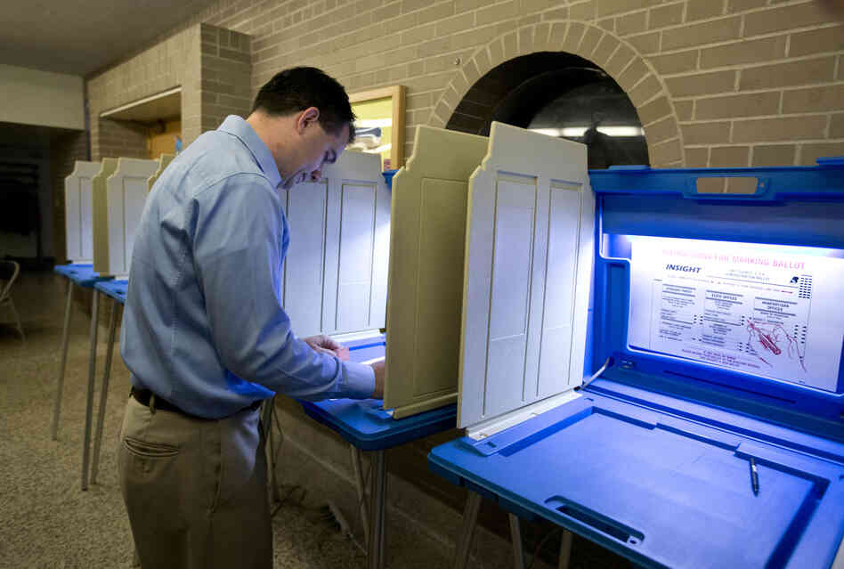 Walker votes in Wauwatosa. He is trying to become the first U.S. governor to successfully fend off a recall.