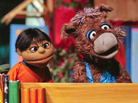 Baily the donkey (right) and Munna, characters from the Pakistani version of Sesame Street, perform at the launch ceremony for the show, Sim Sim Hamara, at Rafi Peer Theater Workshop in Lahore, Nov. 26, 2011. Baily the donkey (right) and Munna, characters from the Pakistani version of Sesame Street, perform at the launch ceremony for the show, Sim Sim Hamara, at Rafi Peer Theater Workshop in Lahore, Nov. 26, 2011.