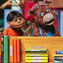 Baily the donkey (right) and Munna, characters from the Pakistani version of Sesame Street, perform at the launch ceremony for the show, Sim Sim Hamara, at Rafi Peer Theater Workshop in Lahore, Nov. 26, 2011.