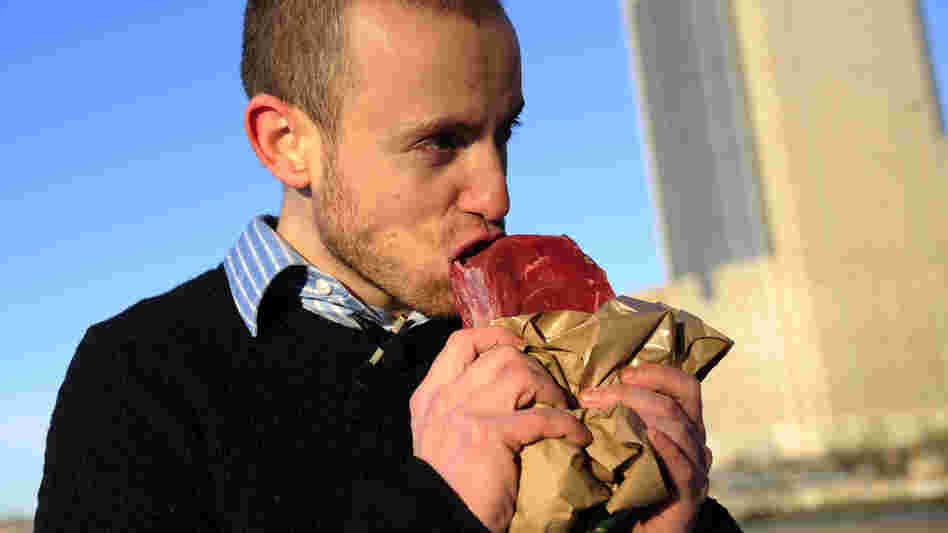 Vlad Averbukh, 29, a follower of the paleo diet, eats raw meat along the Hudson River in New York in 2010. (Averbukh did not weigh in on our blog post on the paleo diet.)