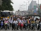 They'd better get out of the way: A Hanoi street scene. They'd better get out of the way: A Hanoi street scene.