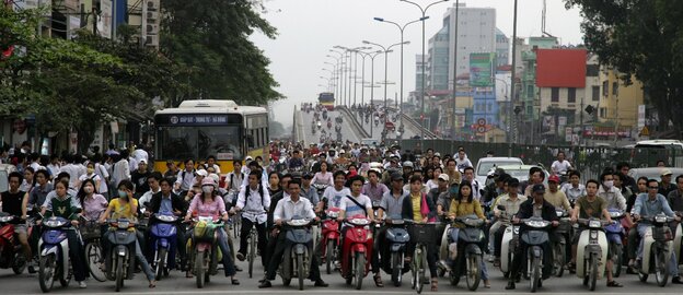 They'd better get out of the way: A Hanoi street scene.