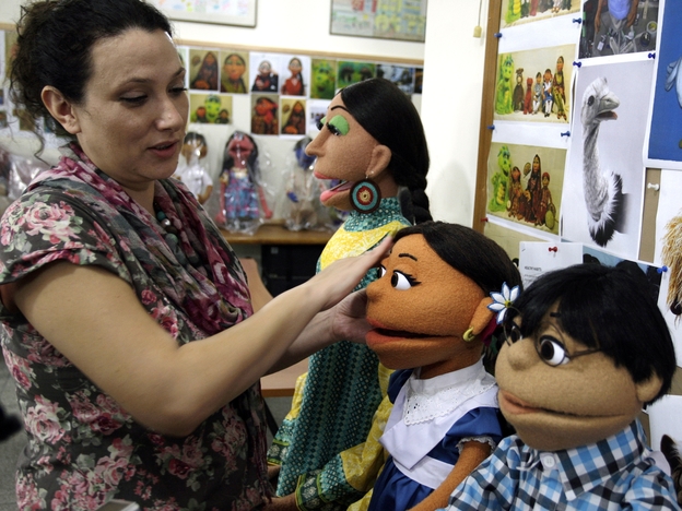 A Pakistani artist in Lahore touches up puppets from Pakistan's Sesame Street. The U.S. Embassy in Pakistan says it has terminated funding for a $20 million project to develop a local version of Sesame Street amid reports of corruption.