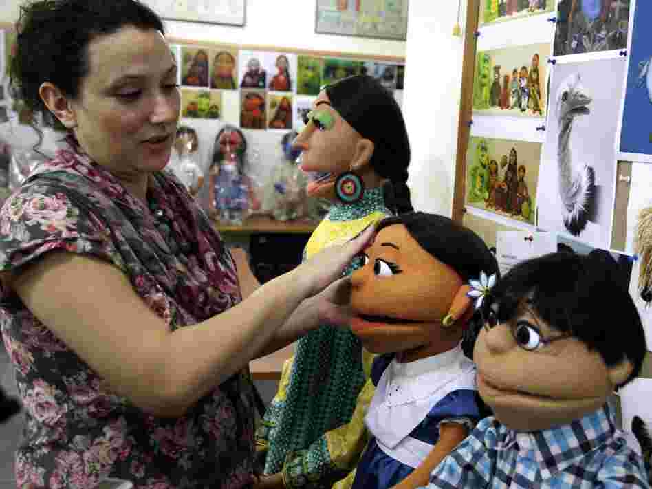 A Pakistani artist in Lahore touches up puppets from Pakistan's Sesame Street. The U.S. Embassy in Pakistan says it has terminated funding for a $20 million project to develop a local version of Sesame Street amid reports of corruption.