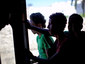 Children ride the train, hopping in and out of the open doors, from Tunis to the suburb of Sidi Bou Said. Children ride the train, hopping in and out of the open doors, from Tunis to the suburb of Sidi Bou Said.