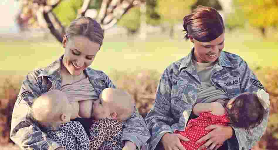 Terran Echegoyen-McCabe and Christina Luna breast-feed their children at Fairchild Air Force Base in Spokane, Wash.