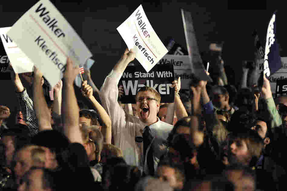 Walker supporters watch returns as they await the governor's speech at an election night rally on Tuesday in Waukesha.