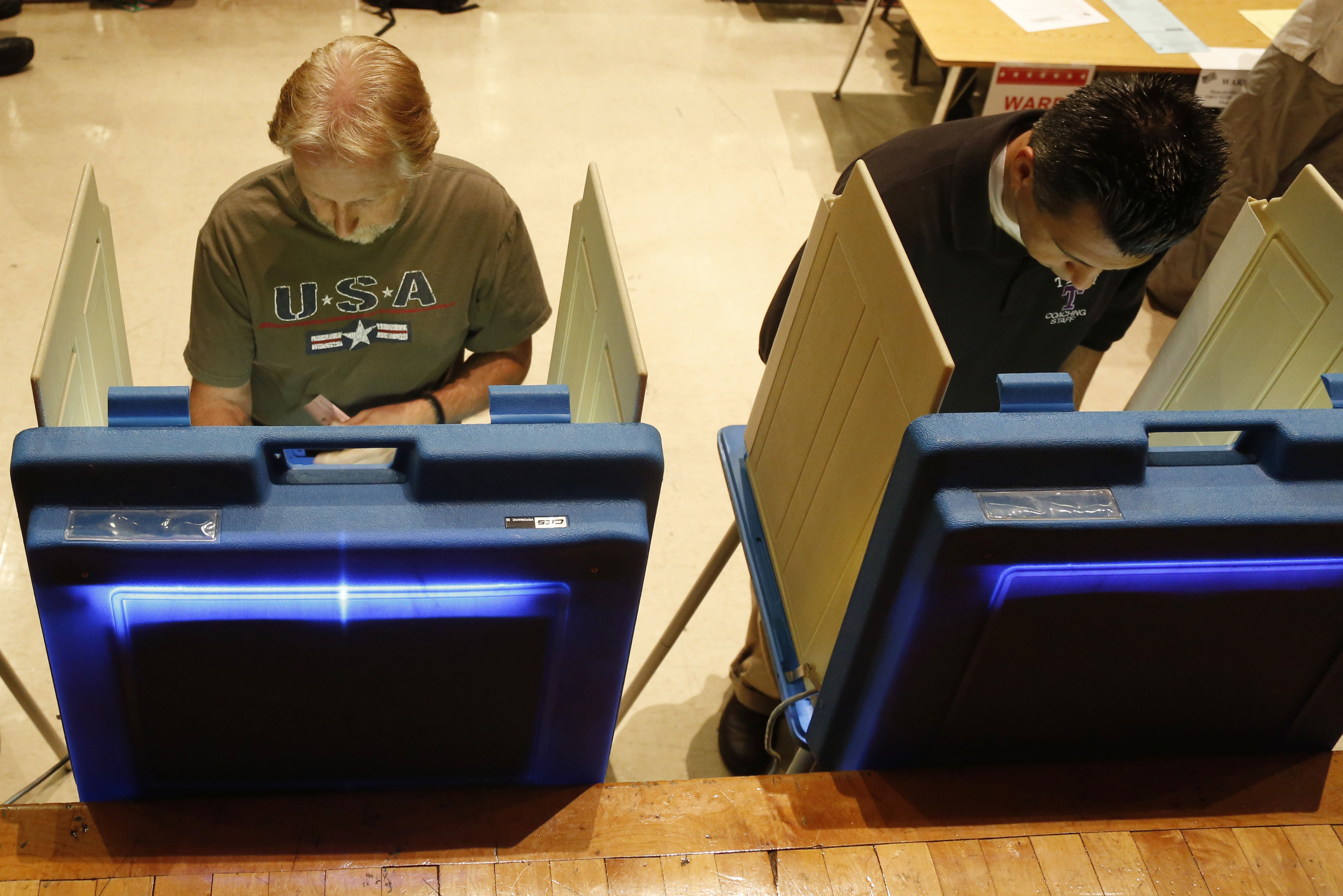 Voters cast ballots in Milwaukee. Critics of the governor gathered more than 900,000 signatures in support of the recall.