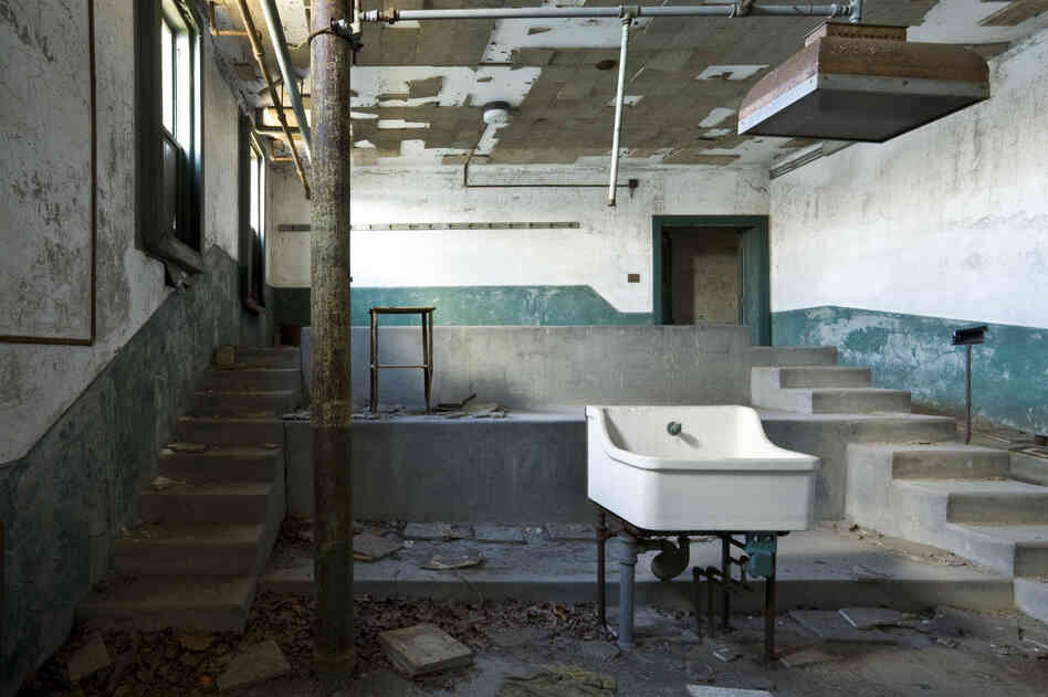 A view of main autopsy theater area at the 1909 mortuary building in Ellis Island hospital in New York City. During the height of immigration to the U.S. from the 1890s to the 1950s millions of immigrants experienced the land of their dreams for the first time in these halls and corridors. The hospital complex has not been restored and remains closed to visitors.