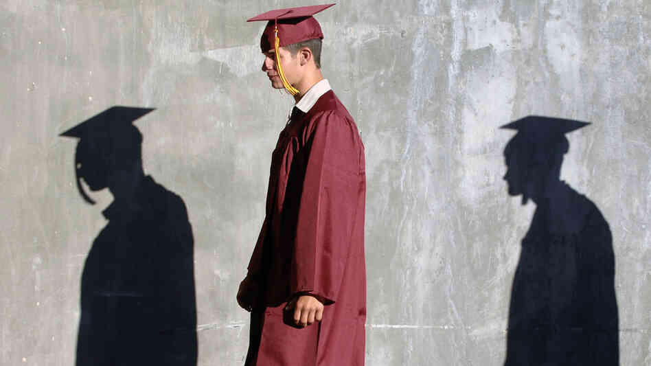 Columbia High School graduates walk to their commencement ceremony in Nampa, Idaho. A new Rutgers University study says nearly half of recent high school graduates are still looking for full-time work.