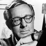 This 1966 file photo shows science fiction writer Ray Bradbury looking at a picture that was part of a school project to illustrate characters in one of his dramas.