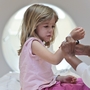 Isabel Doran, 4, gets a CT scan at Children's National Medical Center with her mom, Veronica Doran. The X-ray radiation in CT scans raises the risks for cancer, including leukemia, a new study shows.