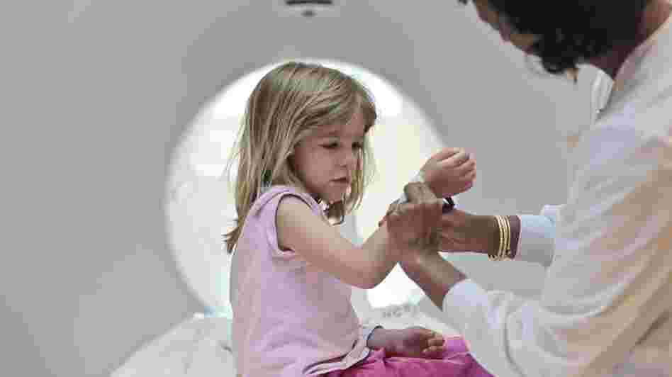 Isabel Doran, 4, gets a CT scan at Children's National Medical Center with her mom, Veronica Doran. The X-ray radiation in CT scans raises the risks for cancer, including leukemia, a new study shows.