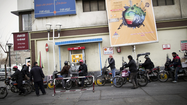 Iranians line up at a gas station to fuel their motorcycles in central Tehran in February. Oil is the lifeblood of Iran's economy, but the planned EU boycott is expected to deal a major blow to Iranian oil exports.