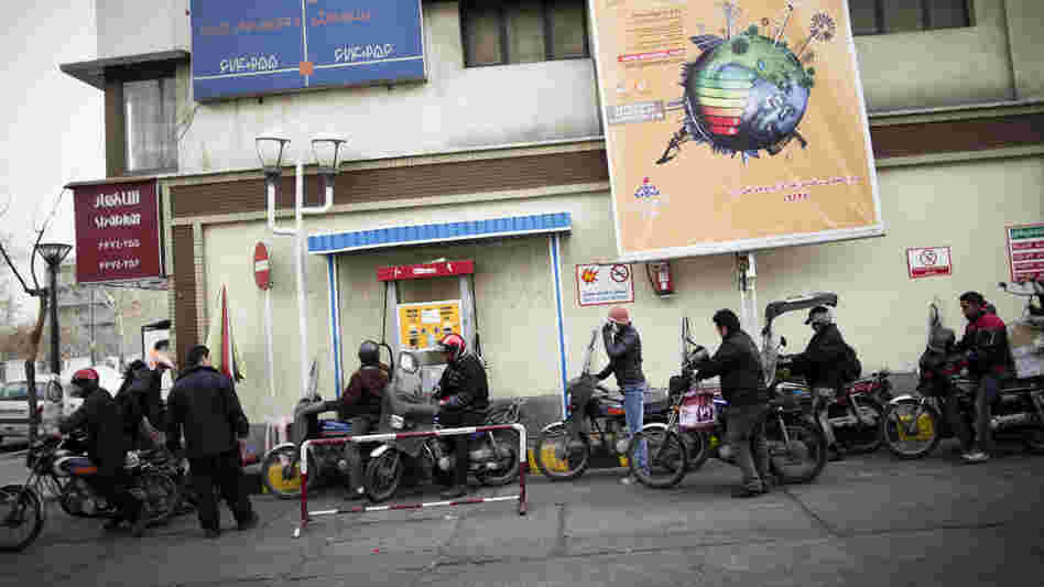 Iranians line up at a gas station to fuel their motorcycles in central Tehran in February. Oil is the lifeblood of Iran's economy, but the planned EU boycott is expected to deal a major blow to Iranian oil exports.