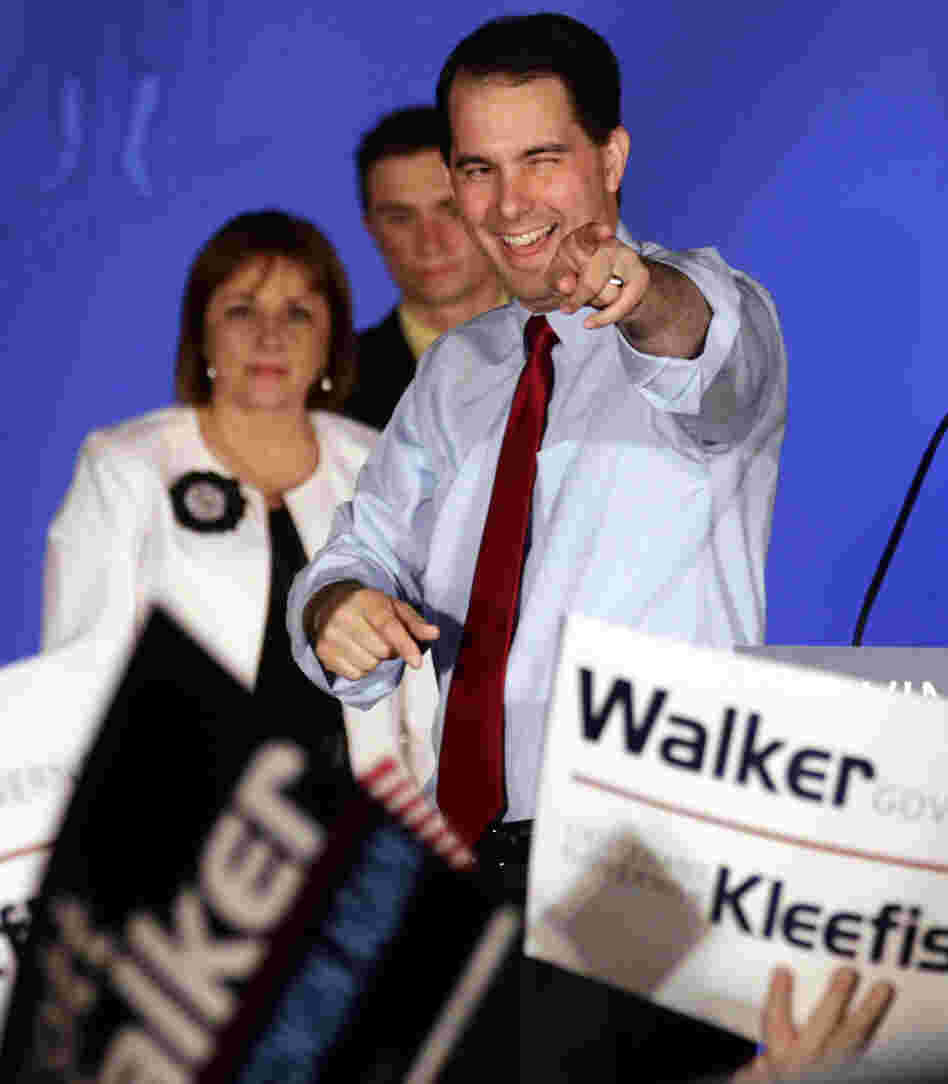 Wisconsin Republican Gov. Scott Walker (right) celebrates his win over Democratic challenger Tom Barrett at Tuesday night's victory party in Waukesha, Wis.