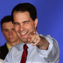Wisconsin Republican Gov. Scott Walker (right) celebrates his win over Democratic challenger Tom Barrett at Tuesday night's victory party in Waukesha, Wis. Wisconsin Republican Gov. Scott Walker (right) celebrates his win over Democratic challenger Tom Barrett at Tuesday night's victory party in Waukesha, Wis.