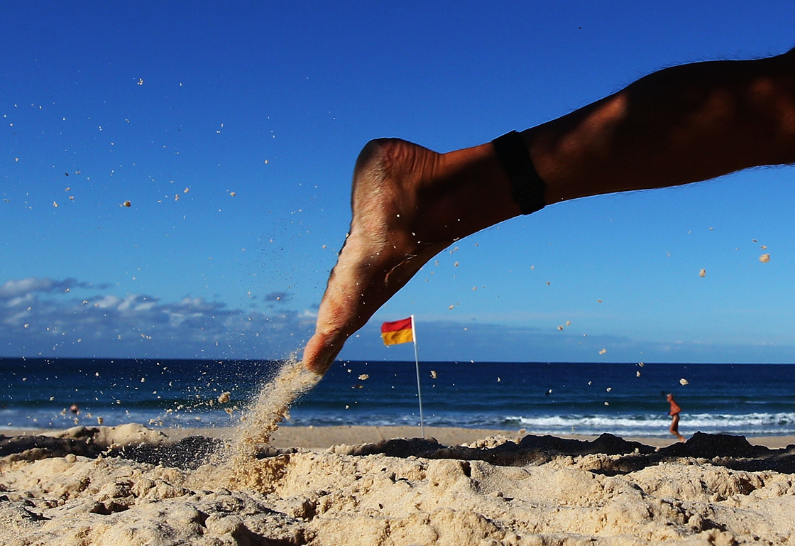 A competitor runs along the beach during the 2012 Bondi Barefoot Race at Bondi Beach on May 27, 2012 in Sydney, Australia.