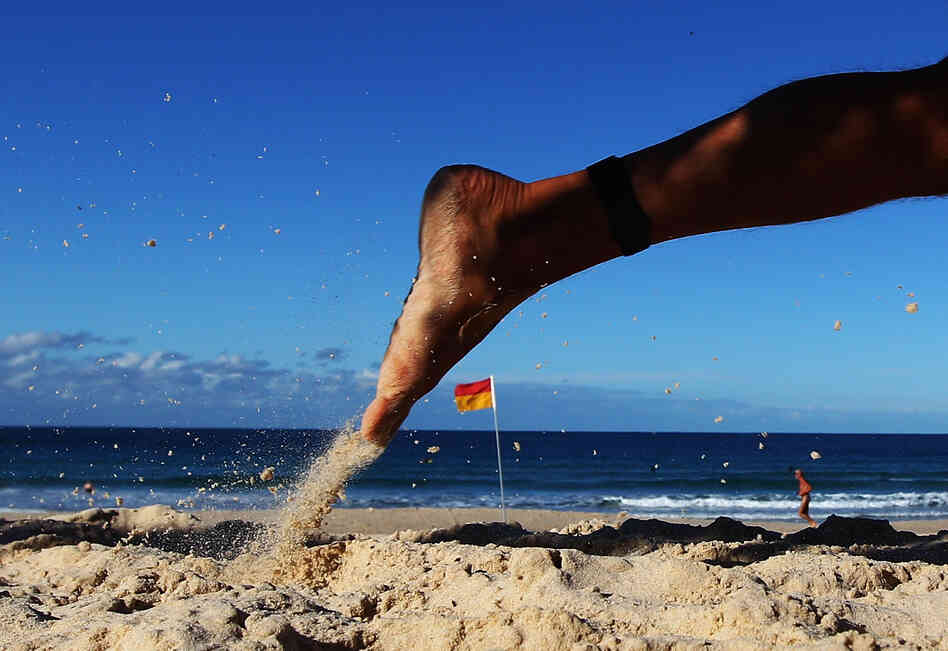 A competitor runs along the beach during the 2012 Bondi Barefoot Race at Bondi Beach on May 27, 2012 in Sydney, Australia.