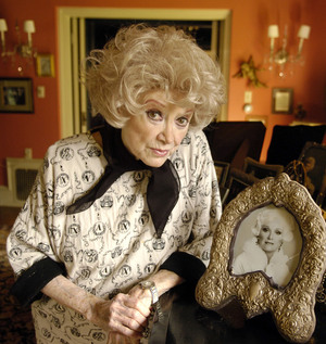 Diller poses with a photo at her Los Angeles home in 2005. Diller poses with a photo at her Los Angeles home in 2005.