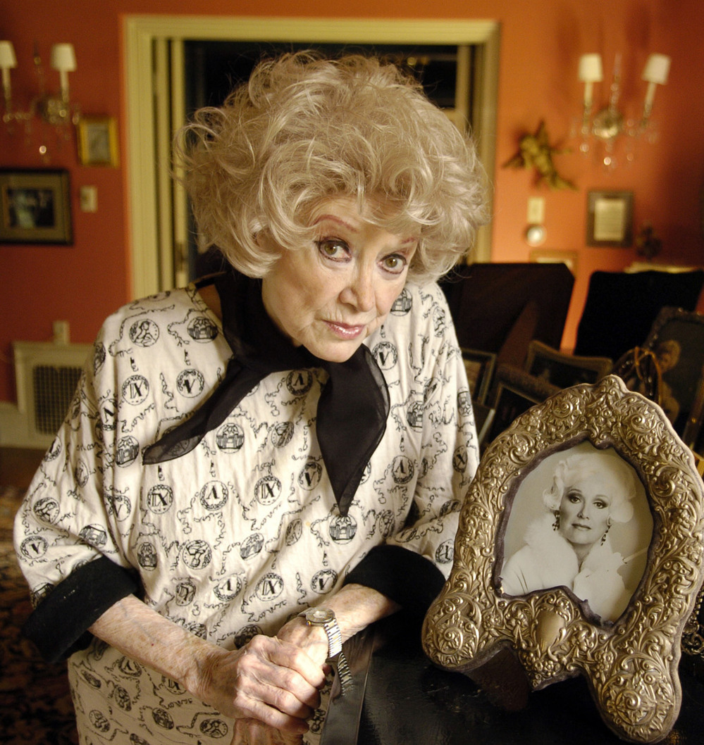 Diller poses with a photo at her Los Angeles home in 2005.