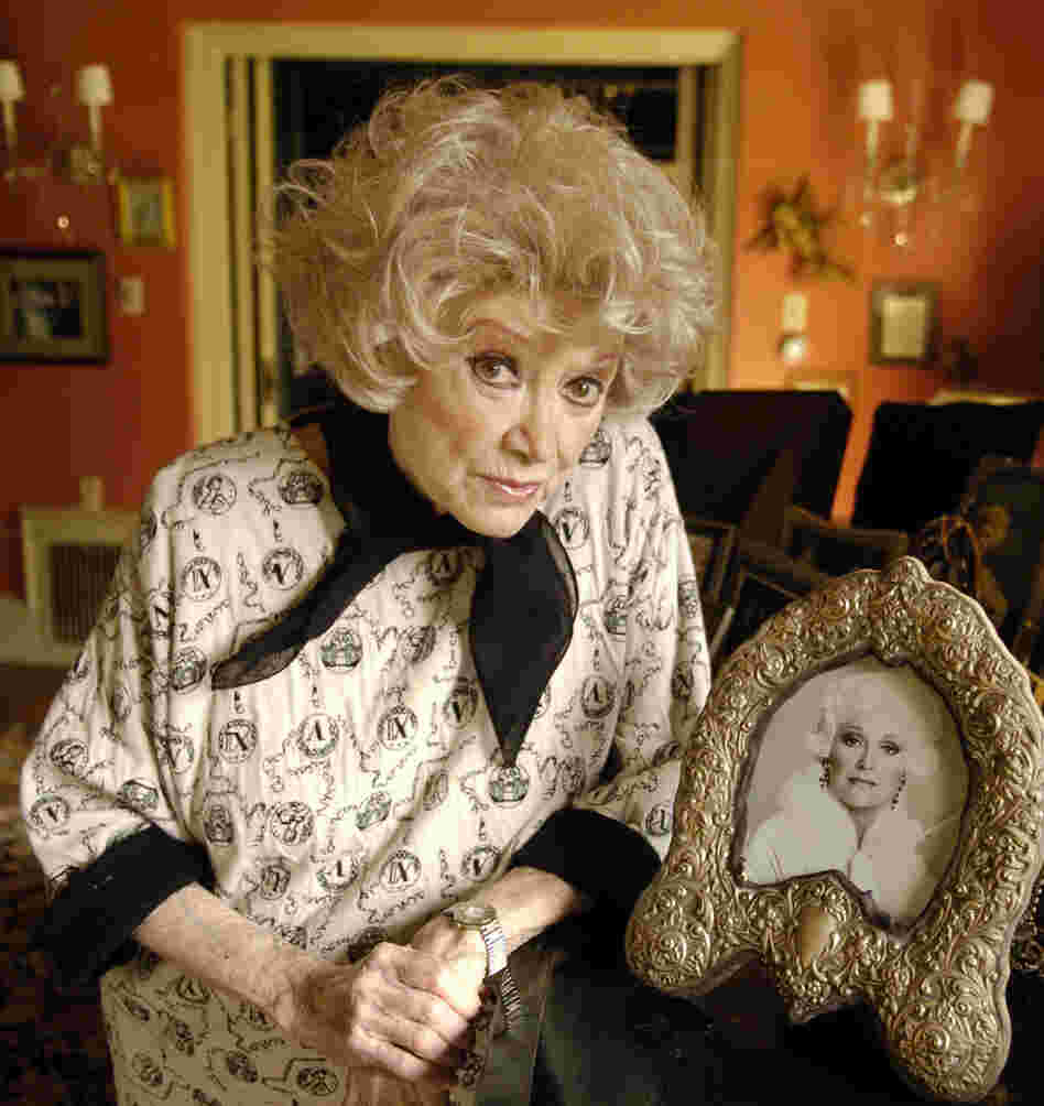 Diller poses with a photo at her Los Angeles home in 2005.