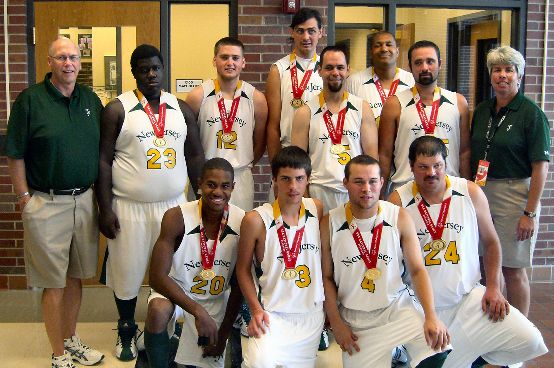 Champions: The New Jersey basketball team -- including Jose Rodriguez (kneeling, second from right) -- poses for the cameras after winning the gold medal at the Special Olympics National Games in 2010.