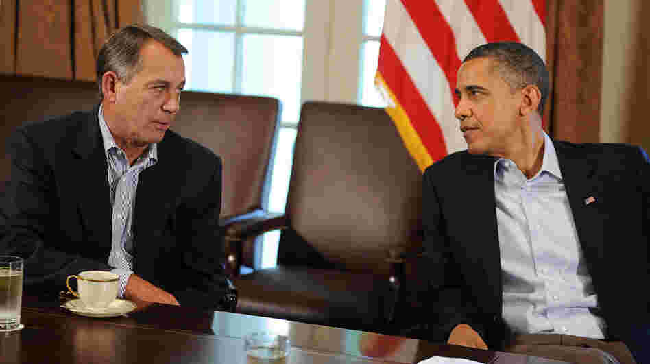 President Obama speaks with House Speaker John Boehner during a meeting at the White House in 2011. A slowdown in job growth and a looming tax deadline could force the president to try to revive his "grand bargain" with Republicans.