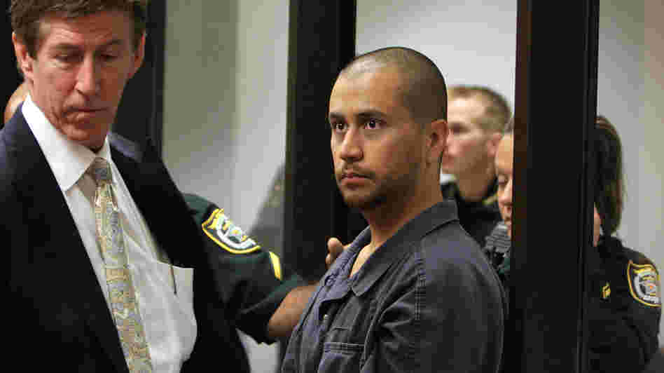 Defense attorney Mark O'Mara (left) stands with his client, George Zimmerman, at a hearing related to second-degree murder charges in the killing of Trayvon Martin in Sanford, Fla.
