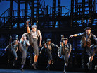 The idea behind Ost's design was to keep the set out of the way of the storytelling -- and of Newsies' kinetic ensemble. The idea behind Ost's design was to keep the set out of the way of the storytelling -- and of Newsies' kinetic ensemble.