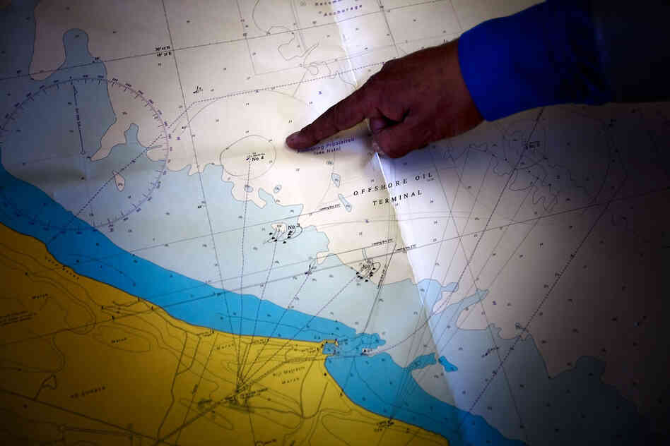 A map of the oil pipelines at Al-Sidrah. The man pointing to the map is Abujala Zenati, who had retired as manager of the operation. He says he returned to work after the revolution to help support the new Libya.