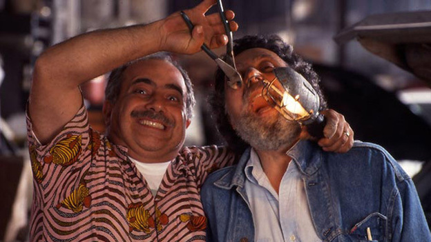 Ray, left, doing some dental work on Tom. (CarTalk.com)