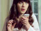 Zooey Deschanel appears in an iPhone 4S Siri commercial.