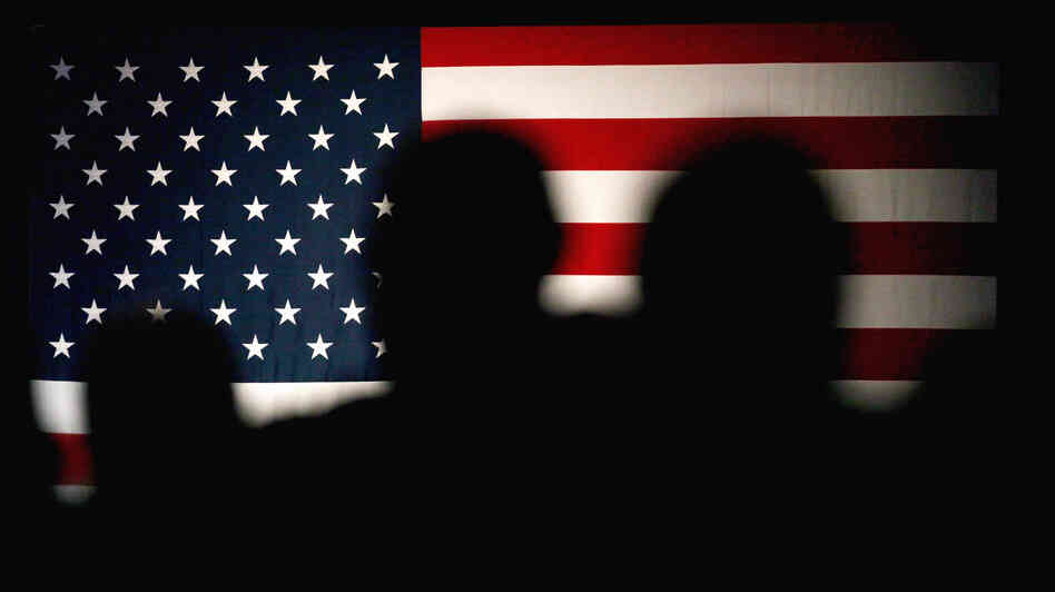 Guests stand after a Rand Paul speech at the Conservative Political Action Conference (CPAC) in Rosemont, Ill. Conservatives celebrated Tuesday's victory in Wisconsin's recall election.