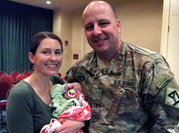 Maj. Matthew Porter, his wife, Jennifer, and their 3-month-old daughter attended the Yellow Ribbon event. They say the deployment strained their relationship, but they are working to keep their marriage healthy.