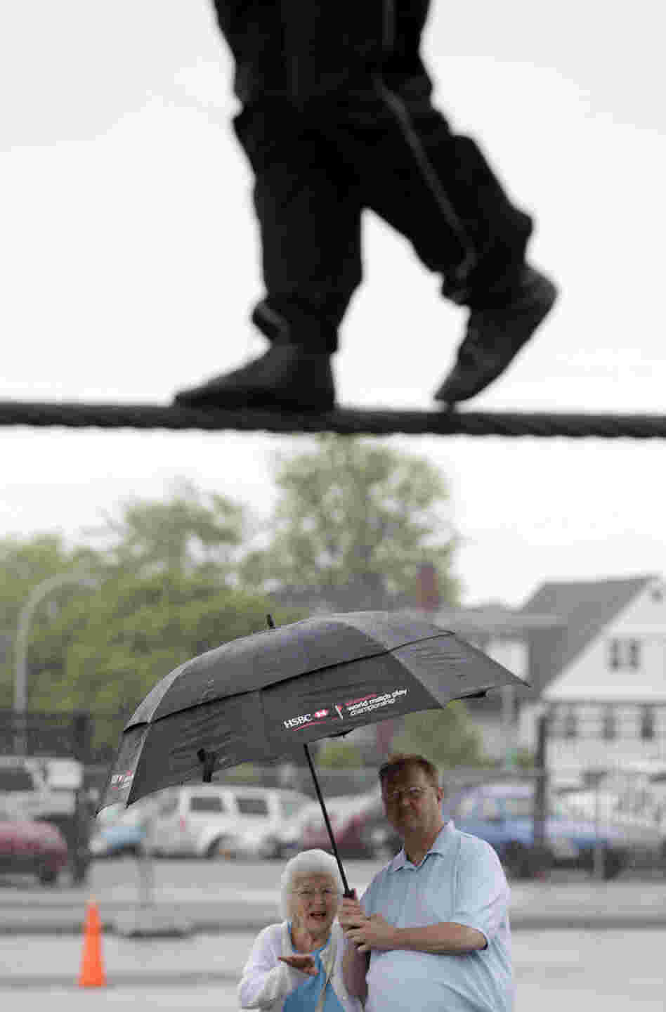 Spectators watch Nik Wallenda practice in Niagara Falls, N.Y. Local officials are hoping the stunt revives flagging tourism. Spectators watch Nik Wallenda practice in Niagara Falls, N.Y. Local officials are hoping the stunt revives flagging tourism.