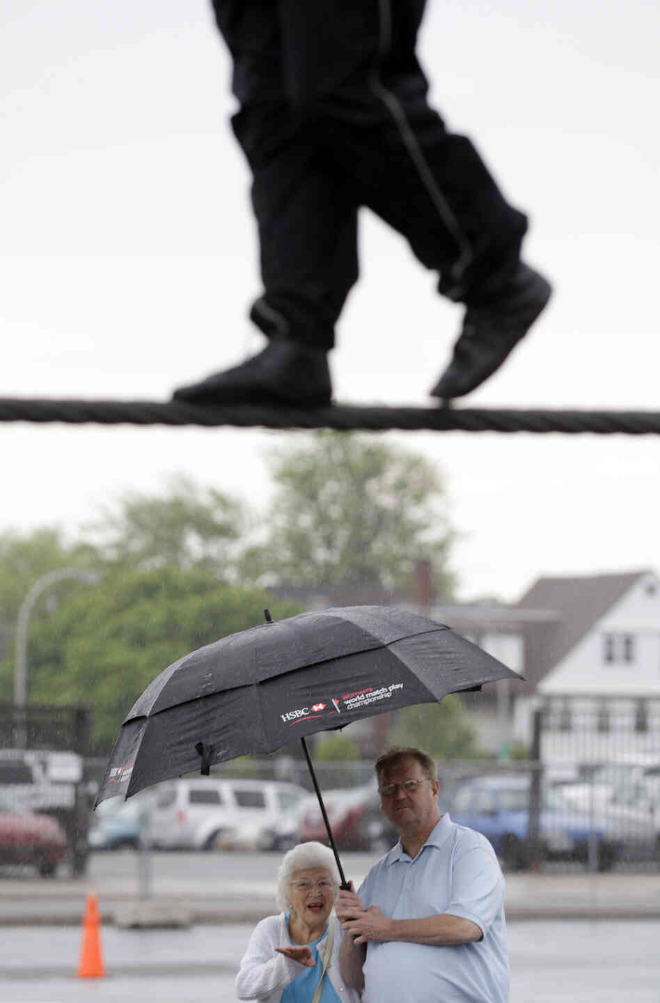 Spectators watch Nik Wallenda practice in Niagara Falls, N.Y. Local officials are hoping the stunt revives flagging tourism. Spectators watch Nik Wallenda practice in Niagara Falls, N.Y. Local officials are hoping the stunt revives flagging tourism.