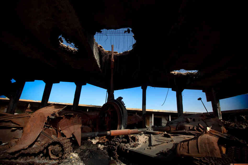 A destroyed building in Misrata holds the damaged remains of tanks that belonged to Moammar Gadhafi's forces. 