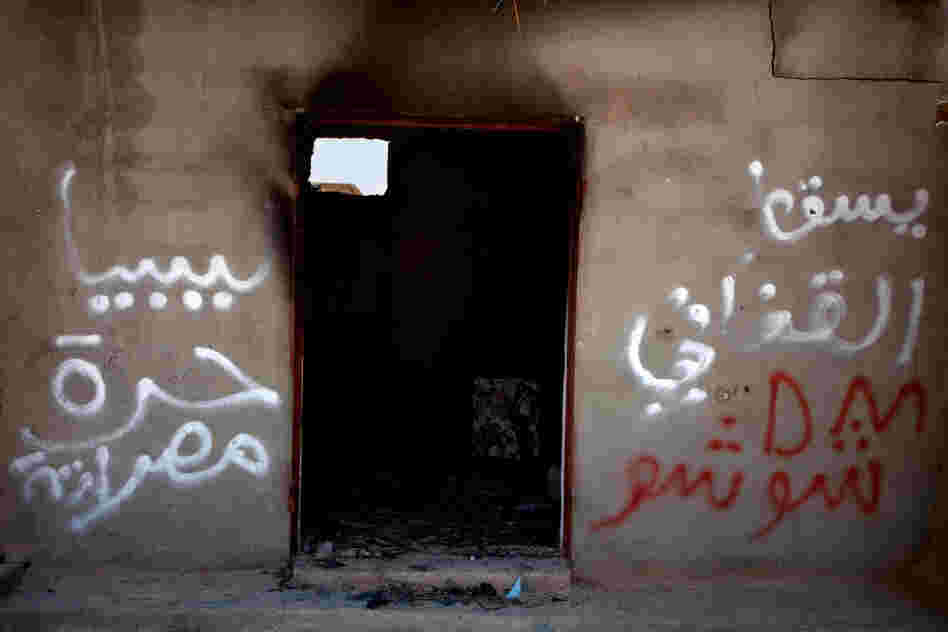 A destroyed home in Tawargha, south of Misrata. Residents were driven out and have not returned, fearing they will be killed. Graffiti in the town talks of "slaves," a reference to the black-skinned people of Tawargha. The town has been unofficially renamed New Misrata.