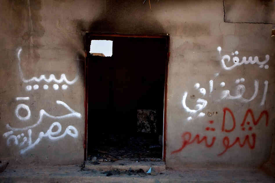A destroyed home in Tawargha, south of Misrata. Residents were driven out and have not returned, fearing they will be killed. Graffiti in the town talks of "slaves," a reference to the black-skinned people of Tawargha. The town has been unofficially renamed New Misrata.