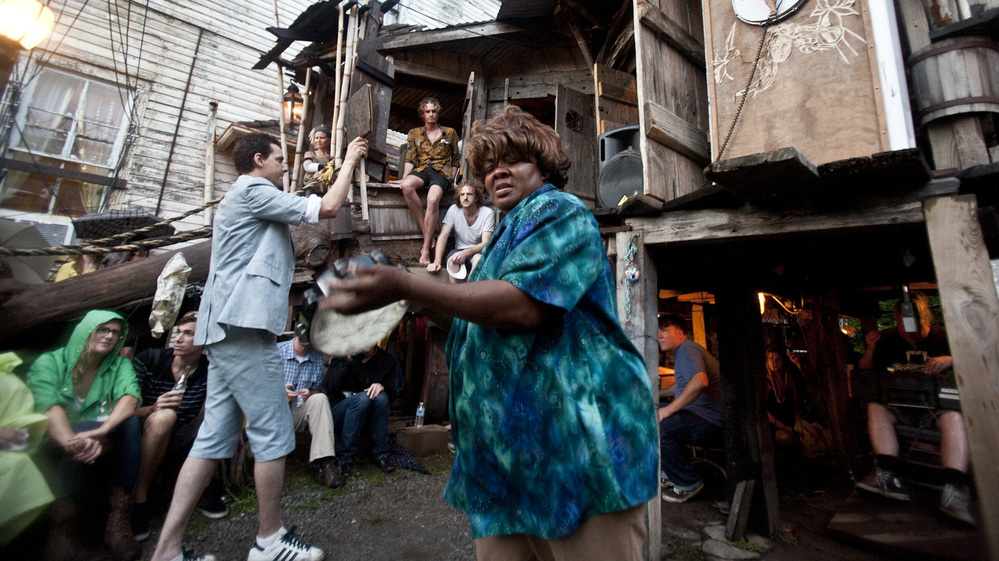 Quintron (at left, in suit and shorts) conducts while Lady Tambourine plays at The Music Box on Saturday night.